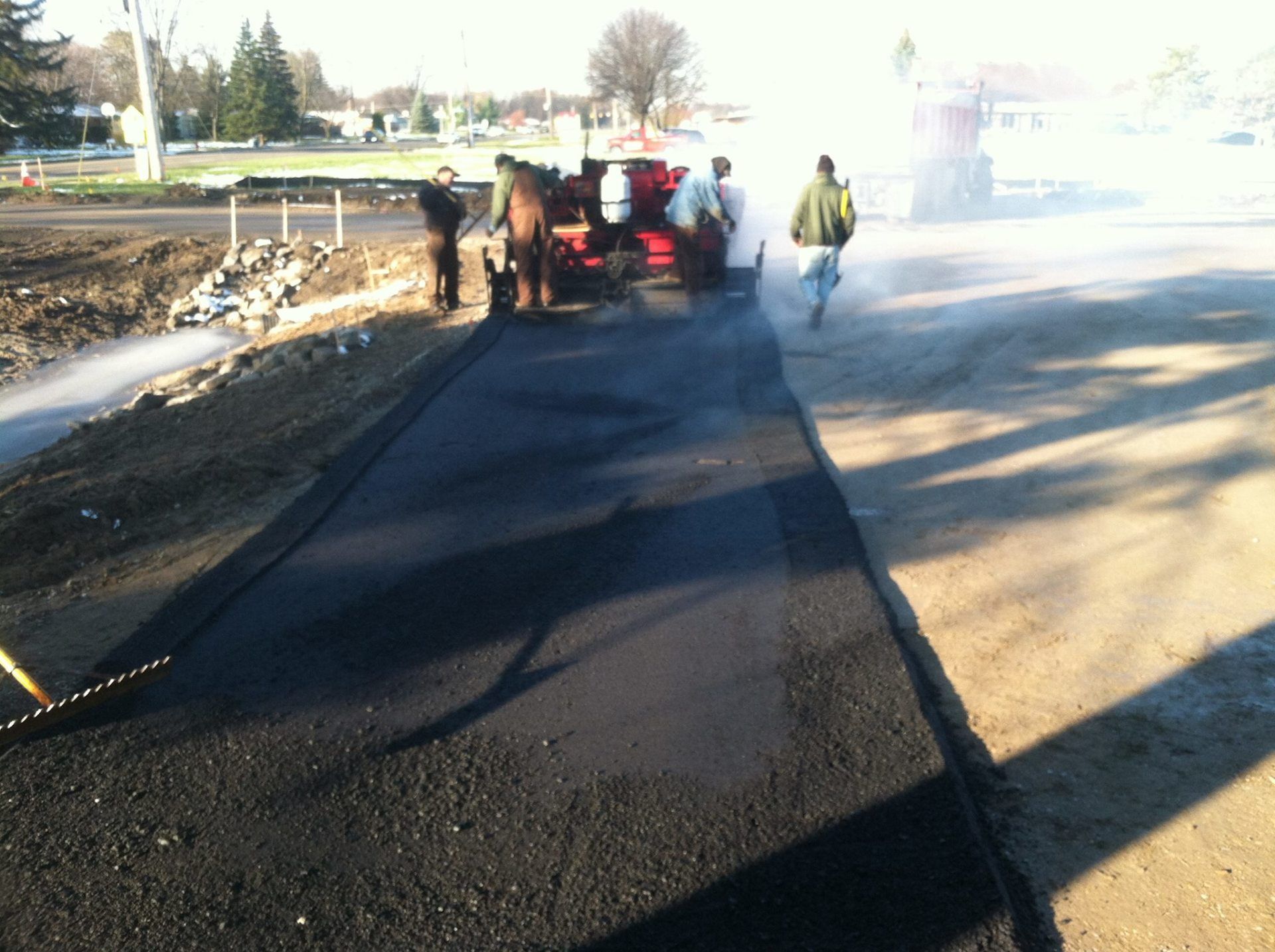 Asphalt Repair— Road During Asphalt Paving in Saginaw, MI