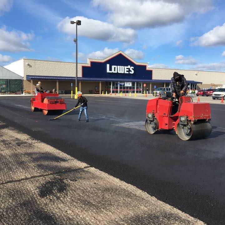 Trusted Asphalt Services — Men Paving Road in Saginaw, MI