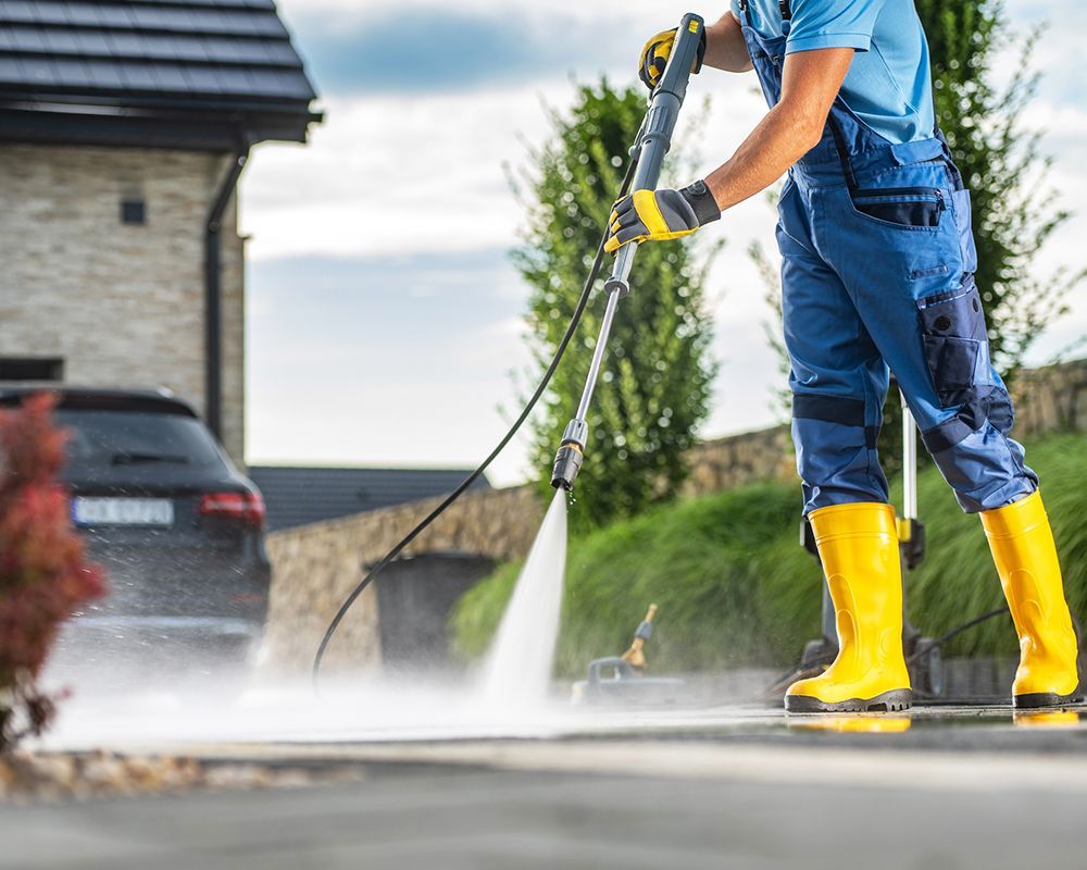 Worker Using High Pressure Washer – Leominster, MA – Flawless Grounds Solutions