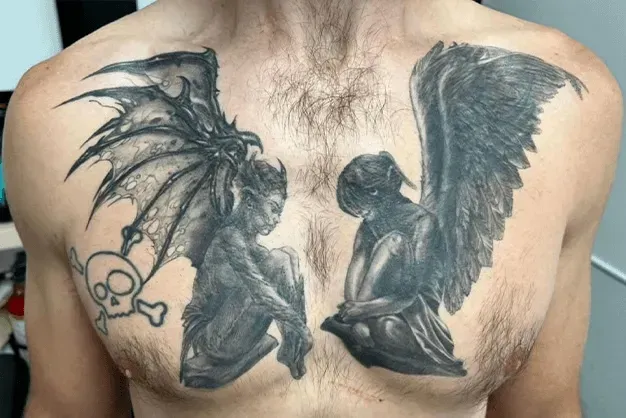 Tattoo of a demon-like figure with bat wings and a skull on the left, an angel with feathered wings on the right.
