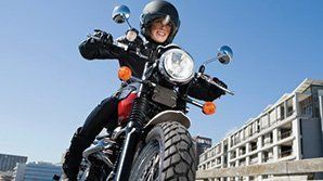 Motorcycle Driver Smiling While Driving — Hopewell, VA — A-1 Insurance Agency