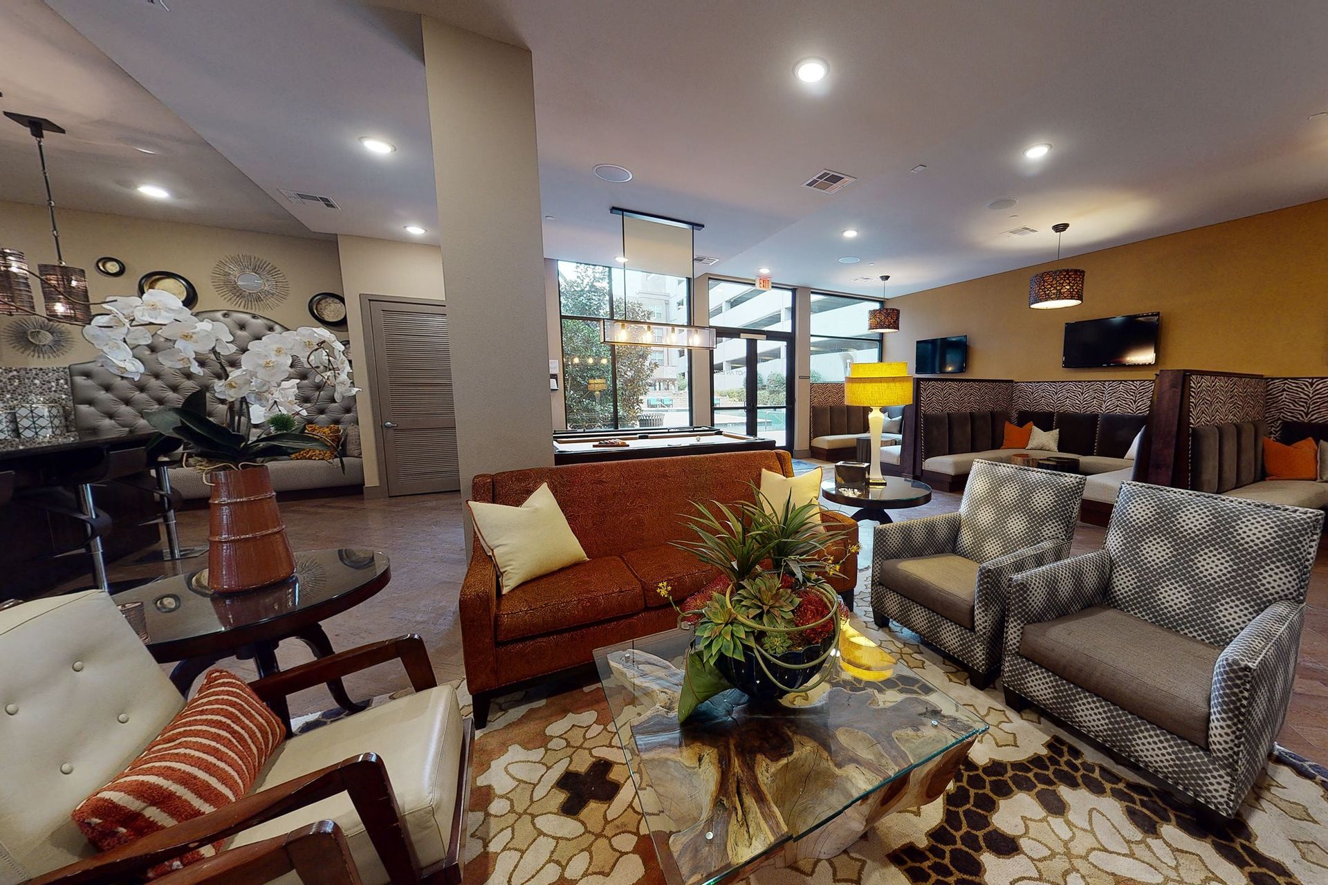 Clubhouse with a couch, chairs, and a coffee table.