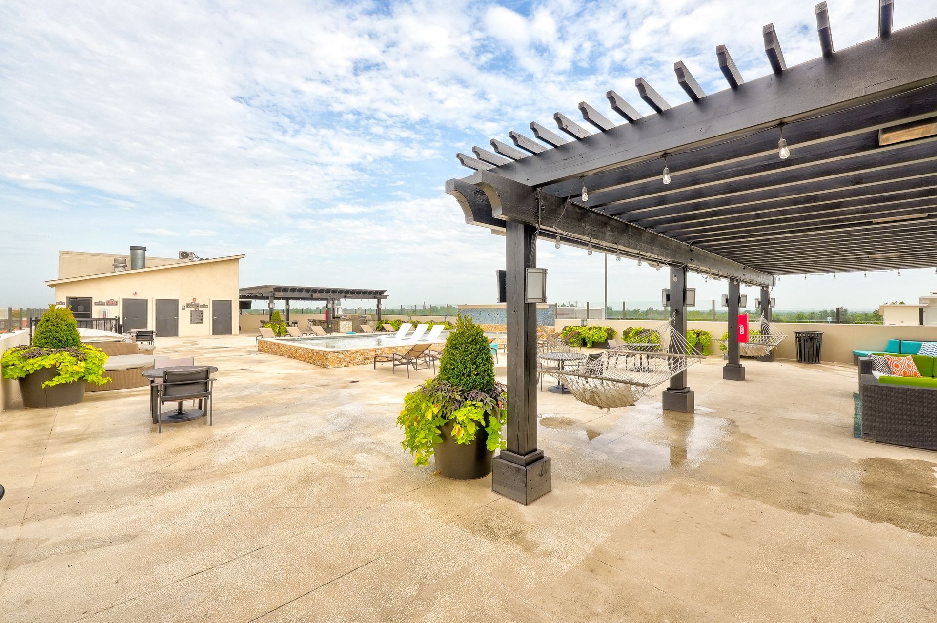 There is a pergola on the roof of a building.
