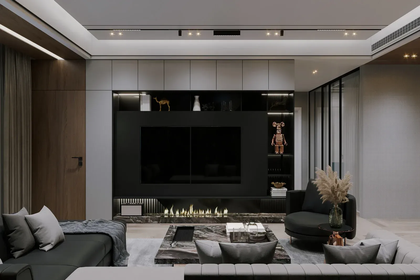 Modern living room with black TV, fireplace, gray furniture, and decorative items.