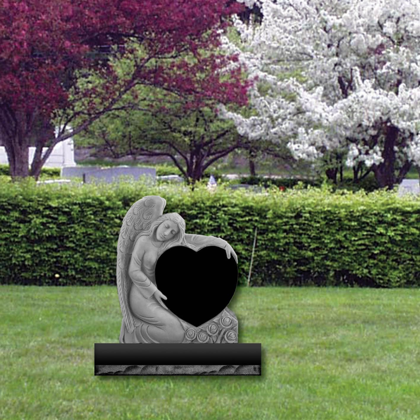 Angel hugging heart headstone