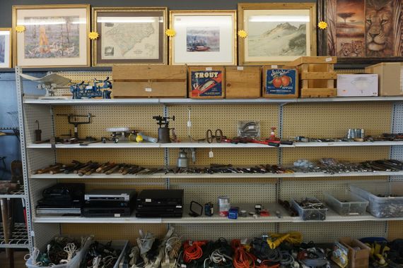 Shelves filled with various items including a box that says ' i-mart ' on it