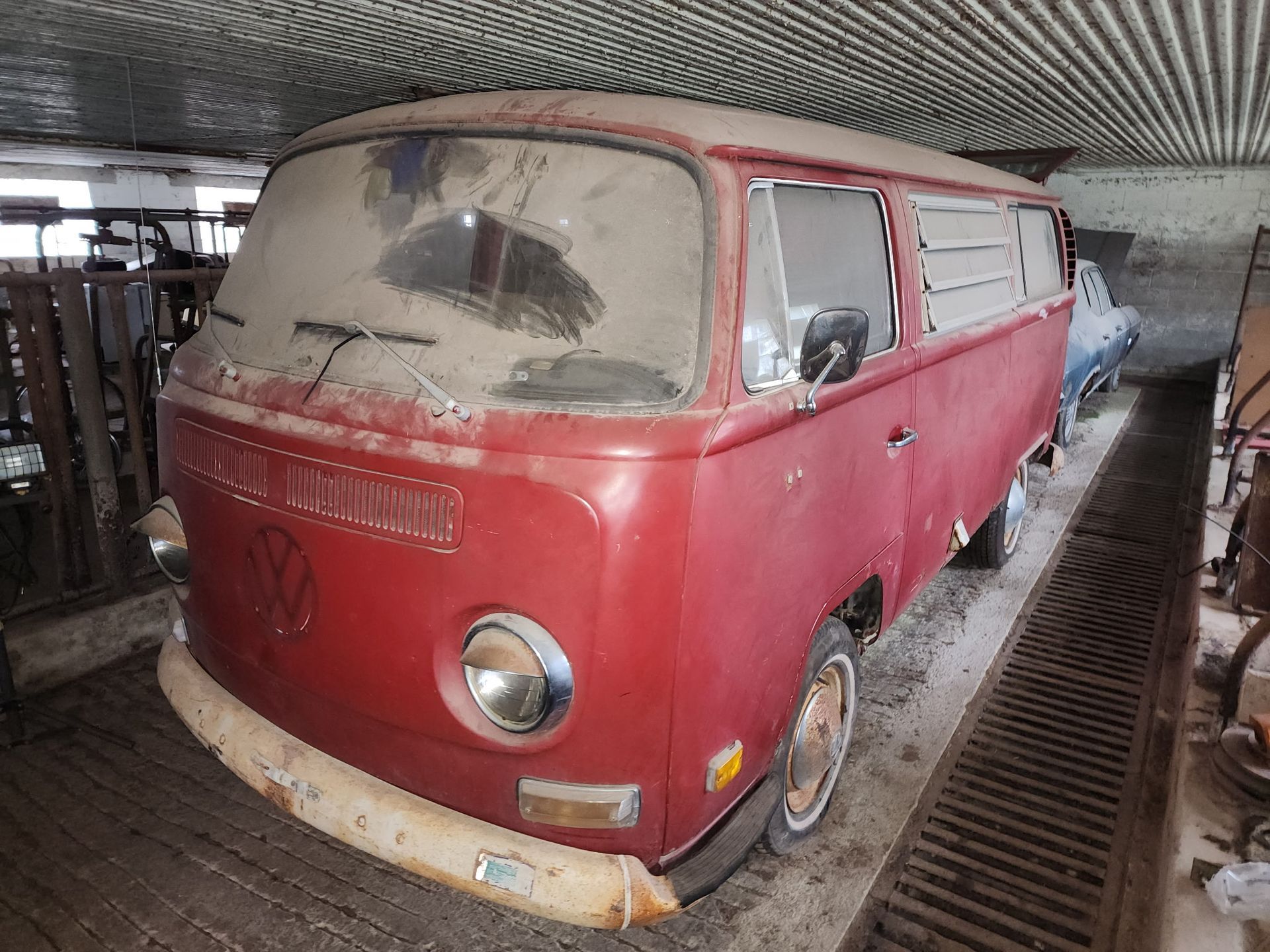 Red sandstone slot canyon, curved walls, sunlight from above.