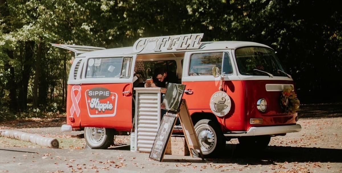 Red sandstone slot canyon, curved walls, sunlight from above.