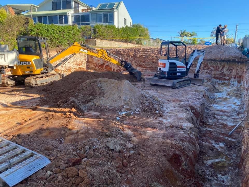 A construction site with a large pile of dirt — Jaya Rose Earthworks and Landscape Contractors In Gulmarrad, NSW