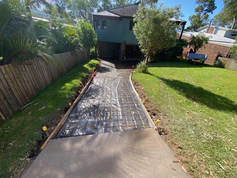 A Concrete Driveway is Being Built — Jaya Rose Earthworks and Landscape Contractors In Gulmarrad, NSW