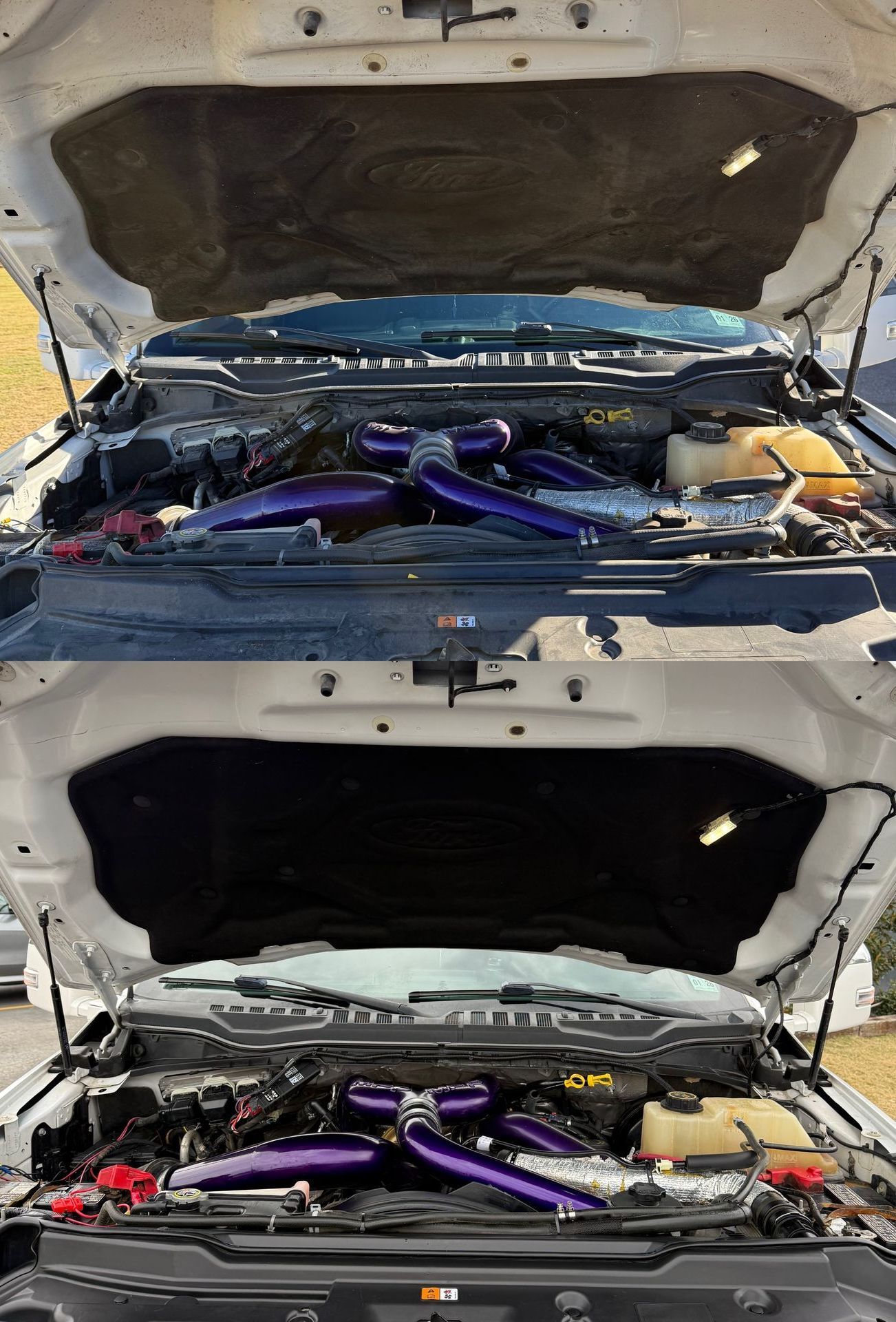 A white truck with the hood open and the engine visible.