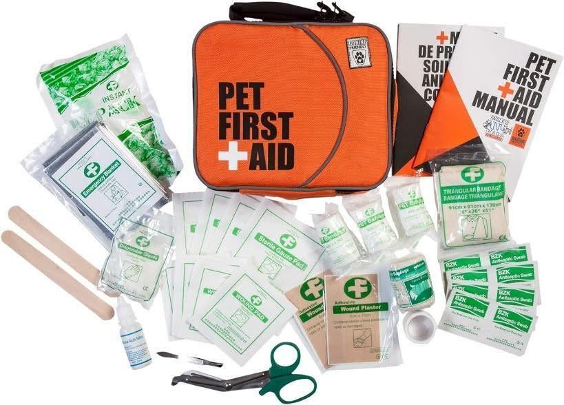 a pet first aid kit with a lot of items in it