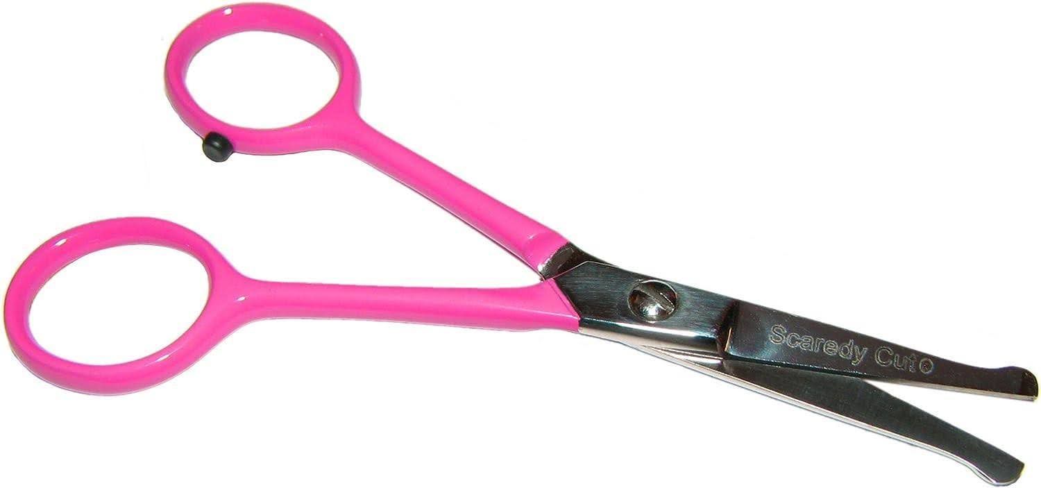 a pair of pink scissors on a white background .
