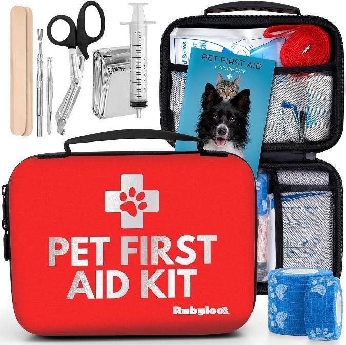 a red pet first aid kit with a picture of a dog on it