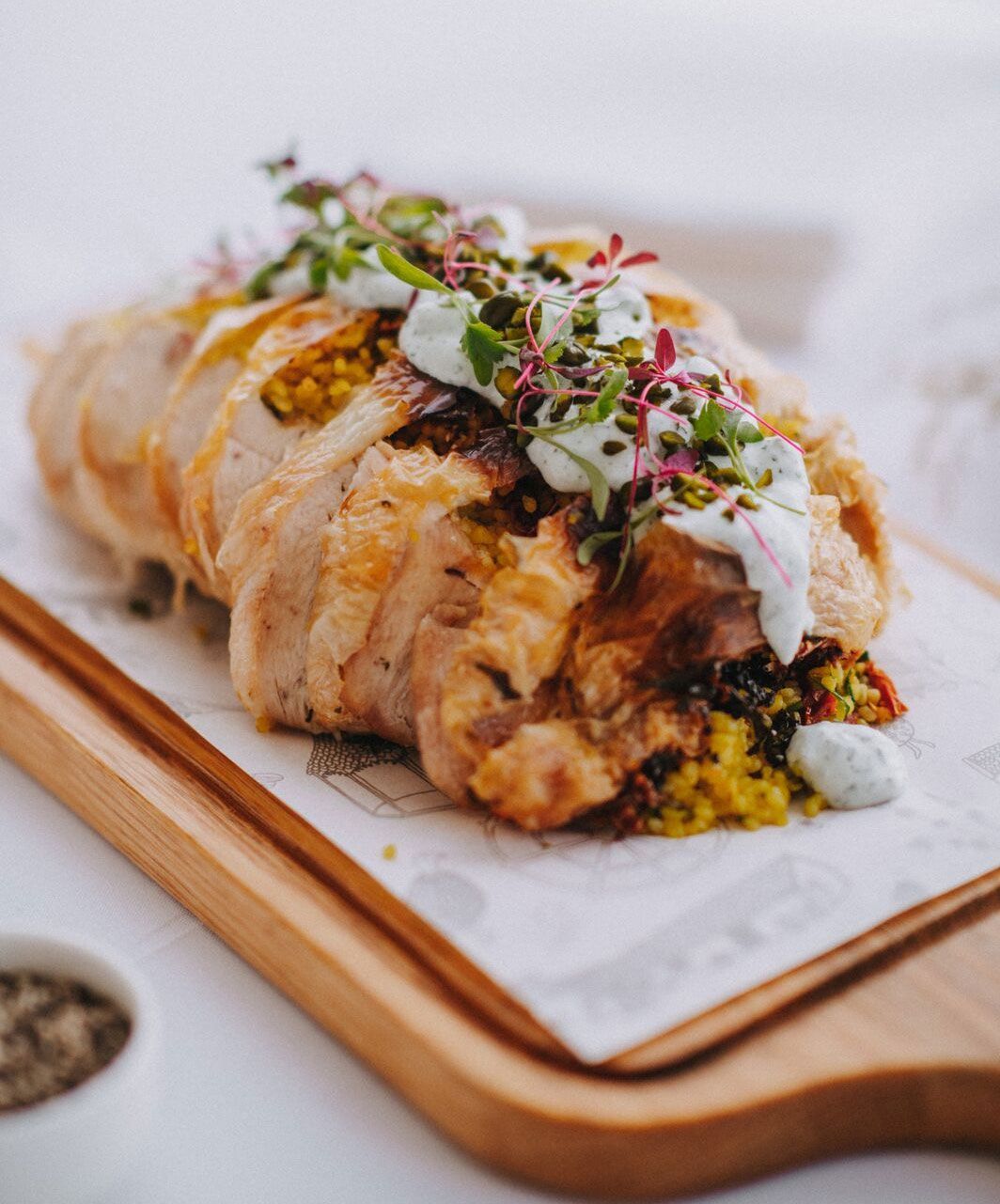 a close up of a piece of food on a cutting board