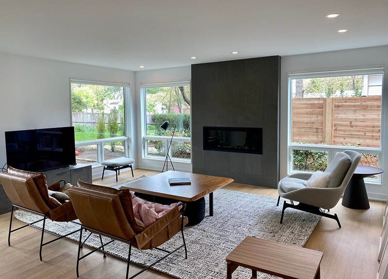 A living room filled with furniture and a fireplace.