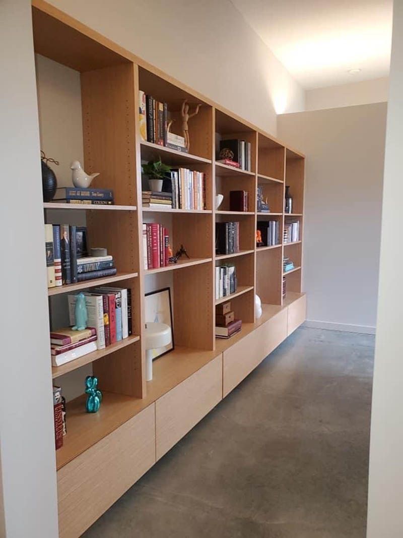 A room with a lot of books on the shelves
