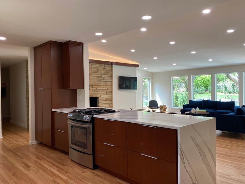 A kitchen with a large island in the middle of the room.