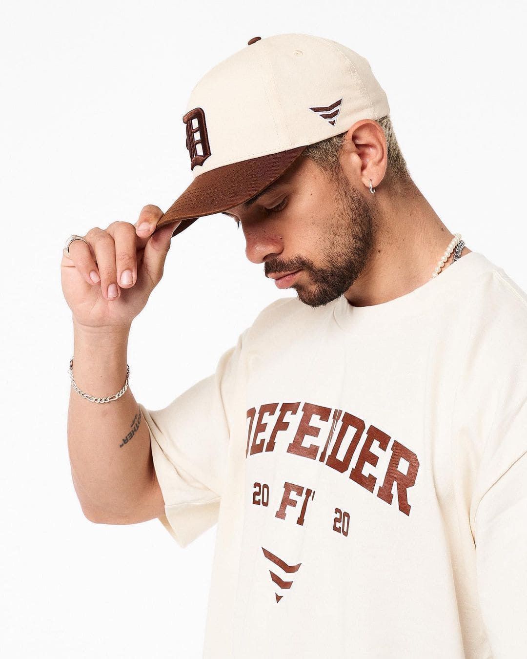 A Man Wearing A Hat And A T-shirt With The Word Feder On It — Carnival Clothing In Miami, QLD