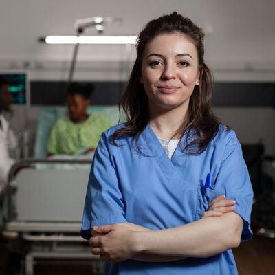 certified medication aide with hospital bed in background in Lexington, KY