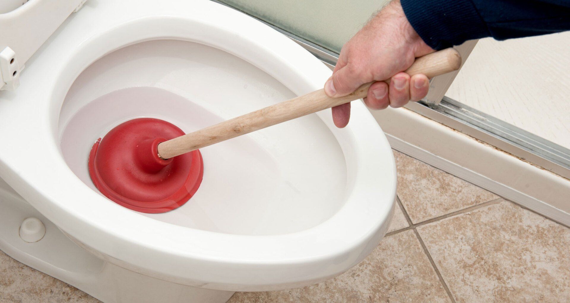 Unclogging Toilet — Ramona, CA — Rooter-Man Plumbers Of San Diego