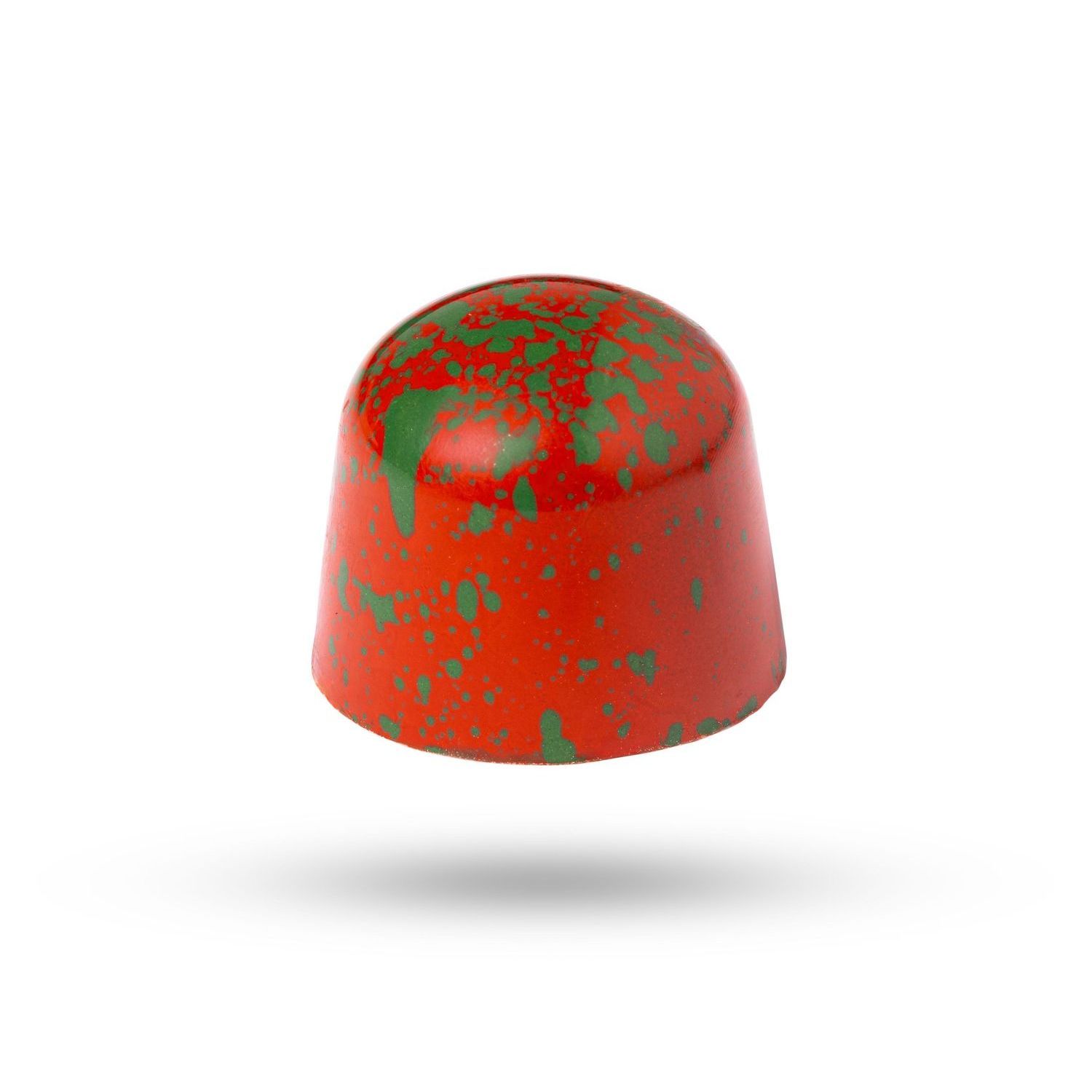 Rood en groen gespikkelde chocoladebonbon, rond met een platte bodem, zwevend.