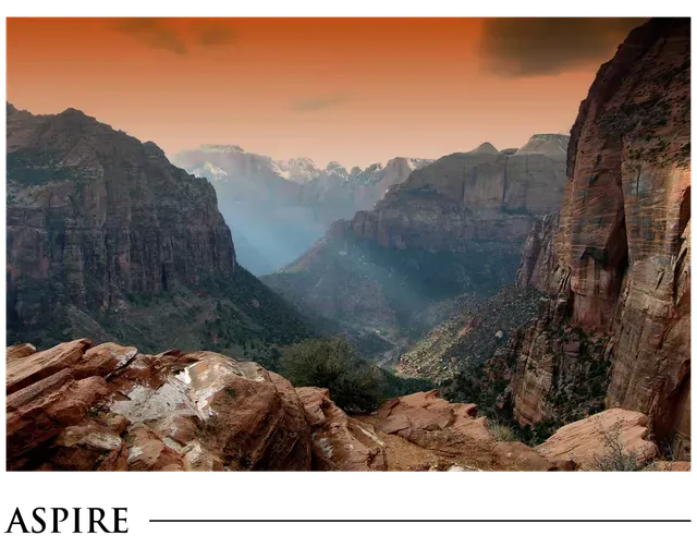 A picture of a mountain range with aspire written on the bottom