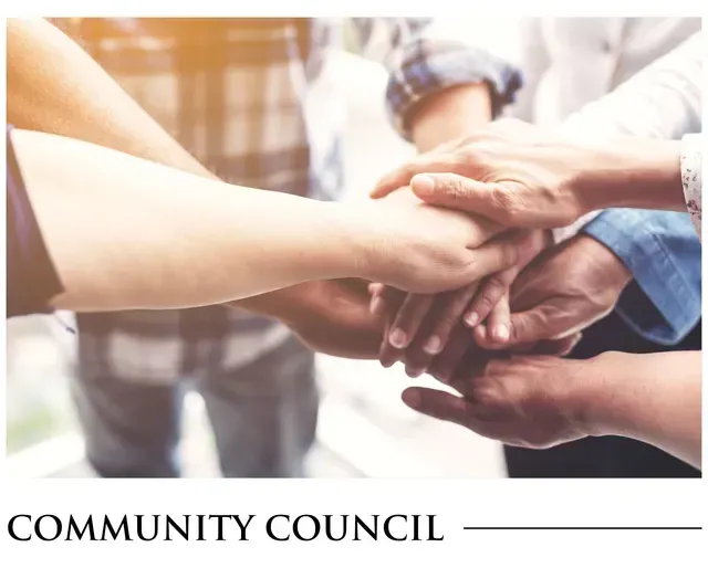 A group of people putting their hands together with the words community council below them