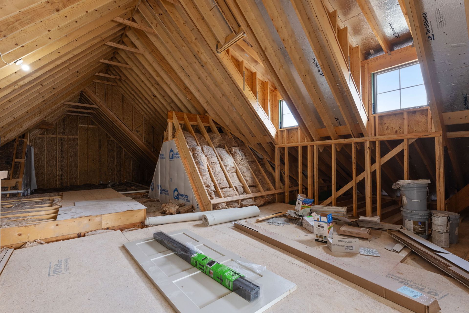 A house is being built with a lot of wood and bricks.