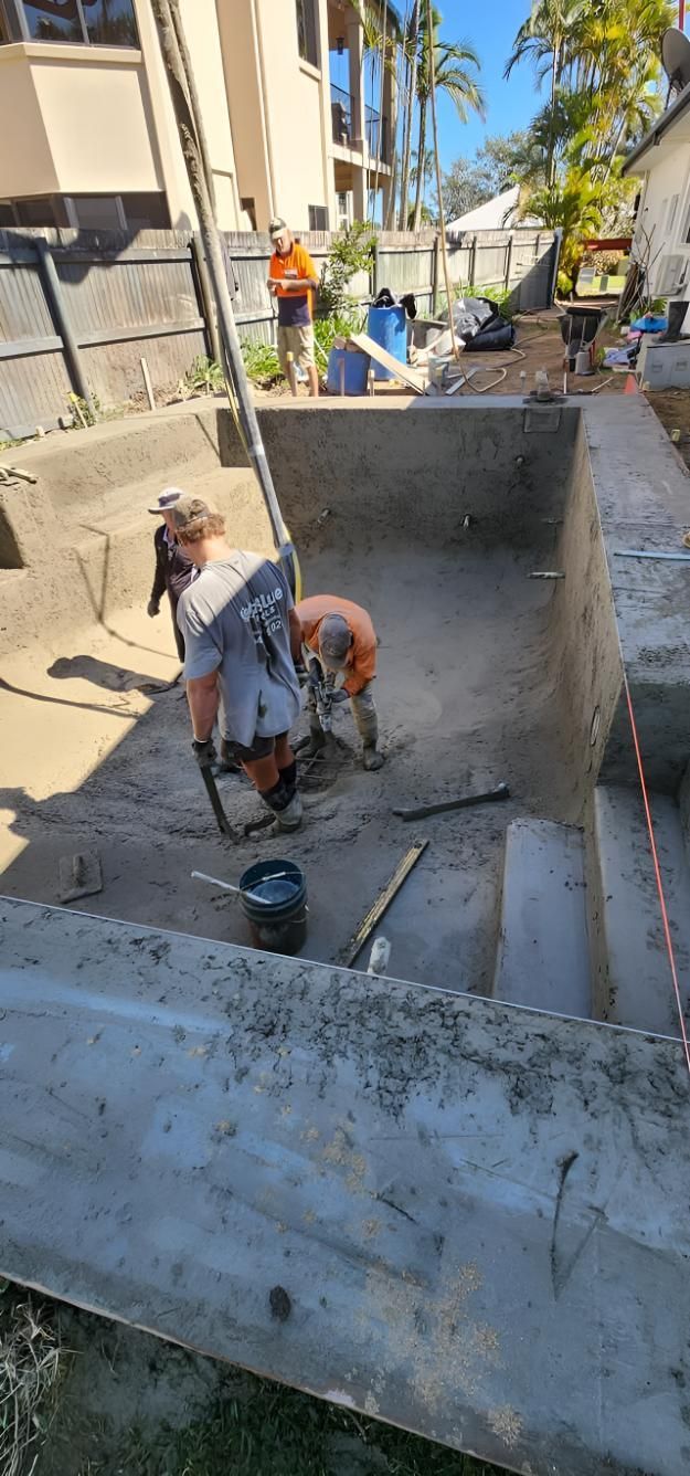 Construction Workers Are Working On A Concrete Pool — Doug Allen Pools In Beaconsfield, QLD