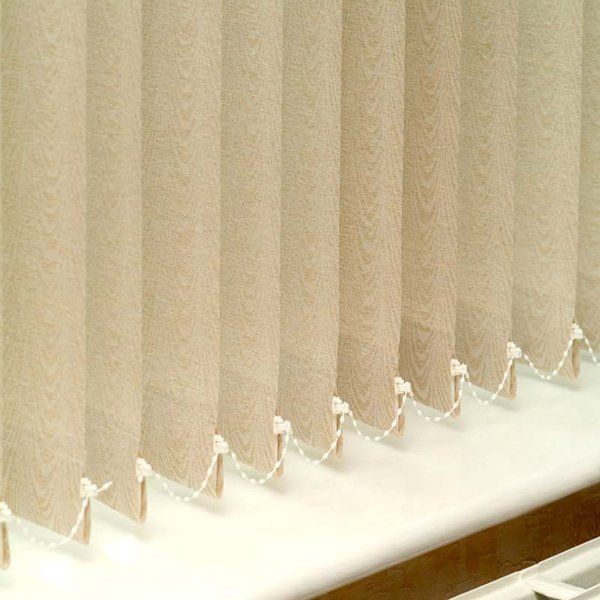 row of beige vertical blinds with beading attached