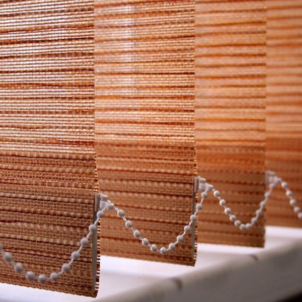 close up of vertical blinds with beading attached