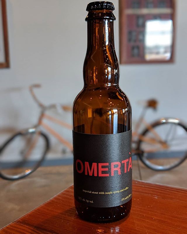 single beet bottle on wooden table at White Rooster