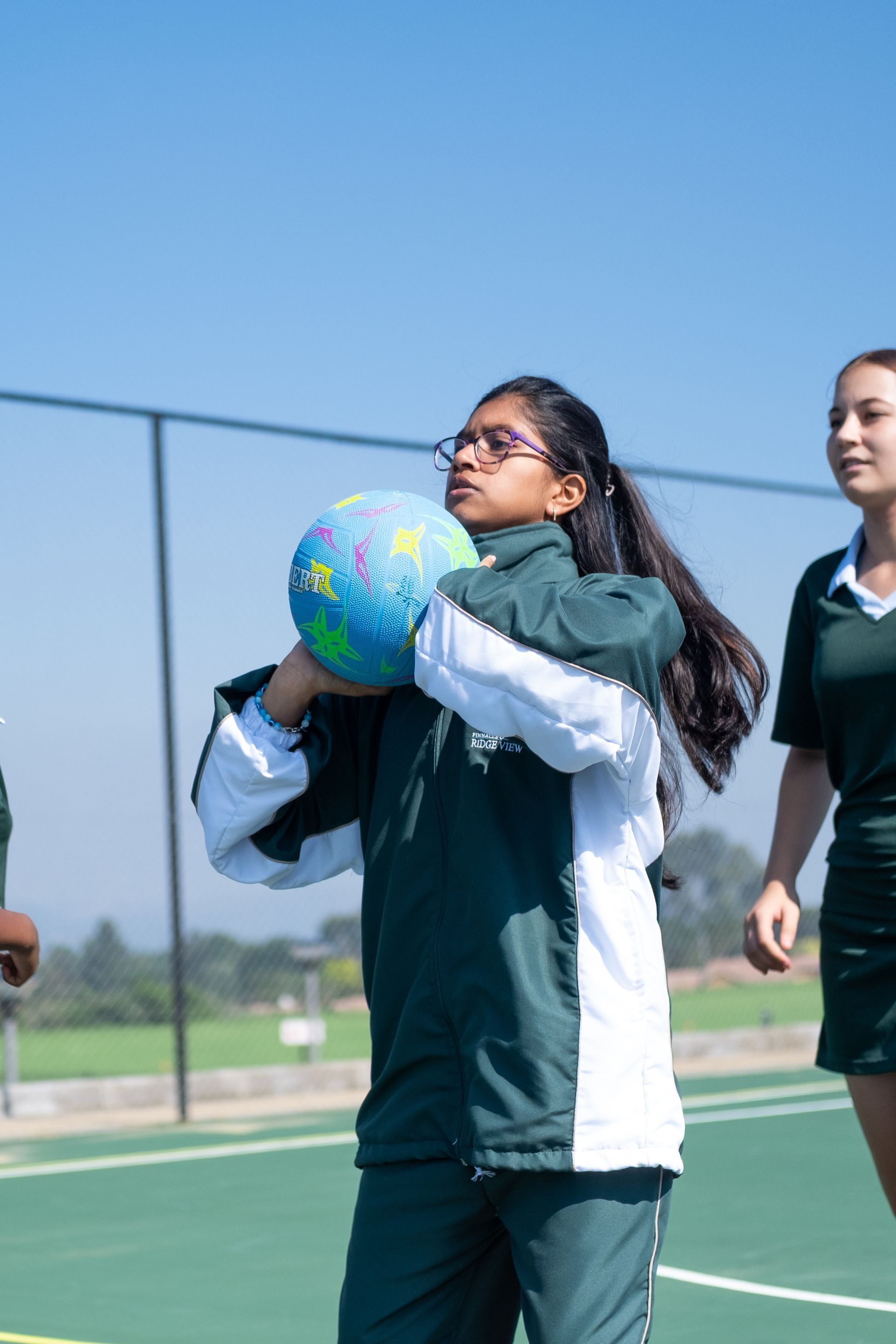 An artist 's impression of a large building with a car parked in front of it.