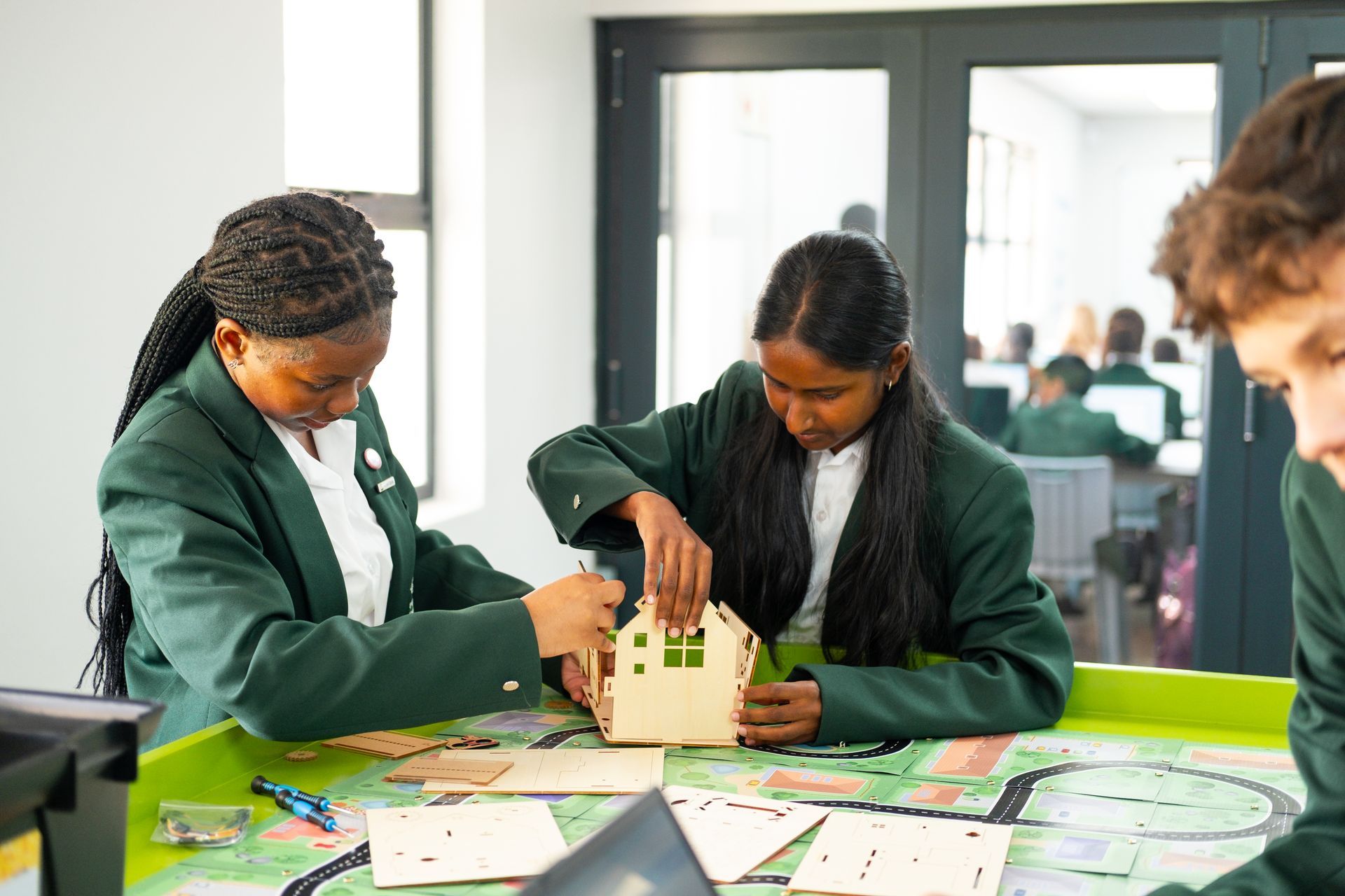 An artist 's impression of a large white building with a courtyard in front of it.