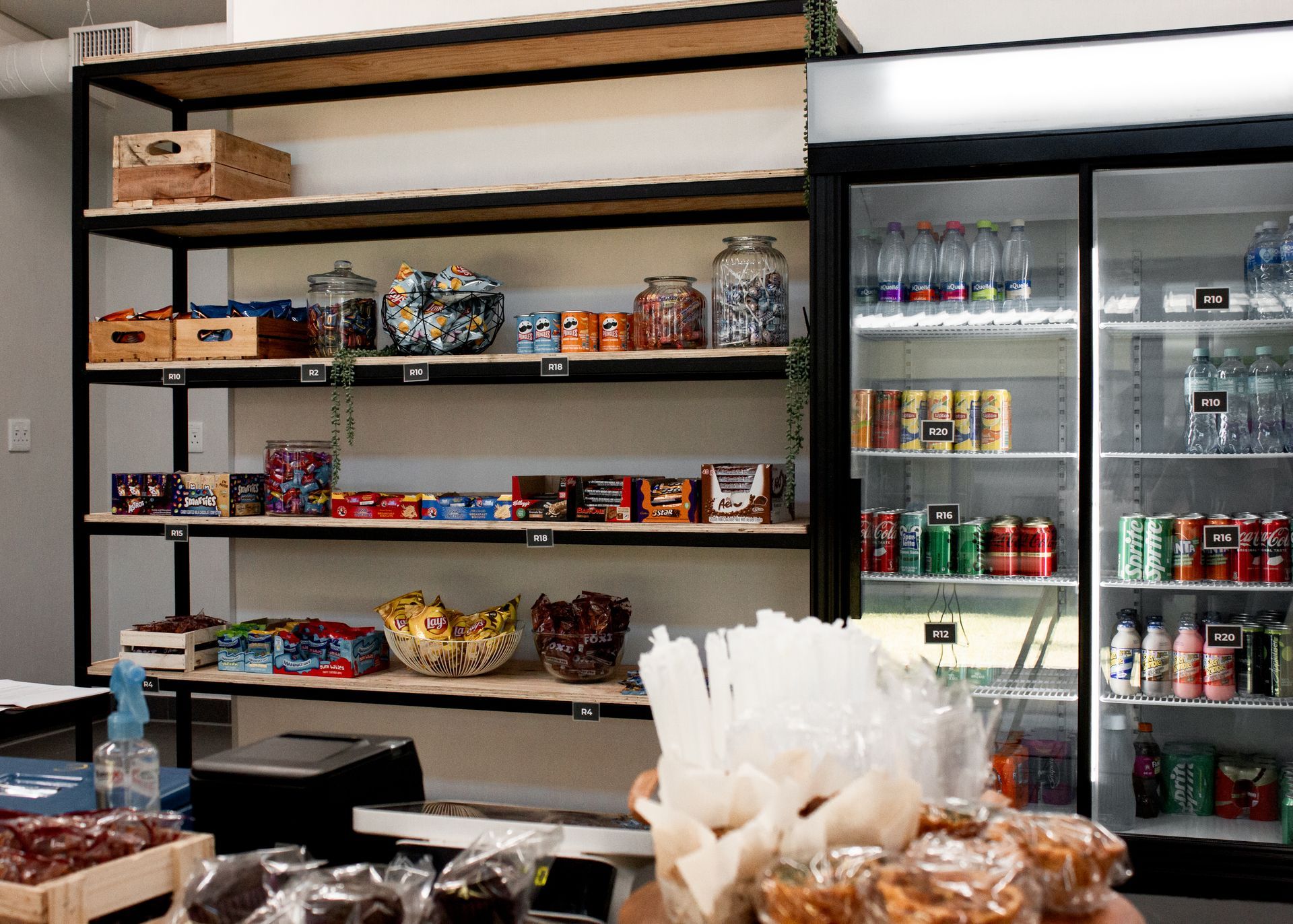 A store filled with lots of food and drinks and a refrigerator.