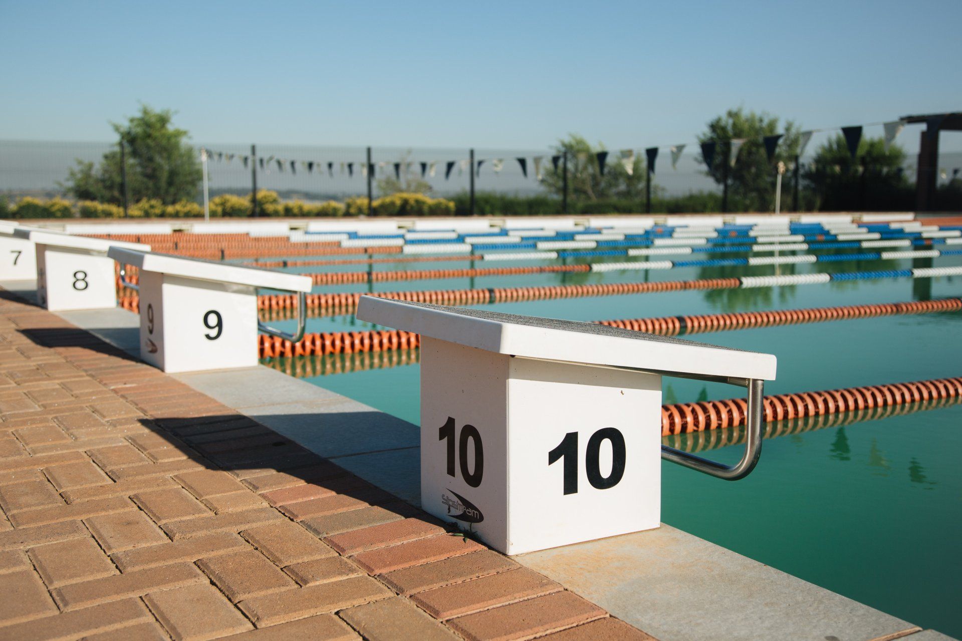 A swimming pool with blocks with the numbers 10 and 10 on them