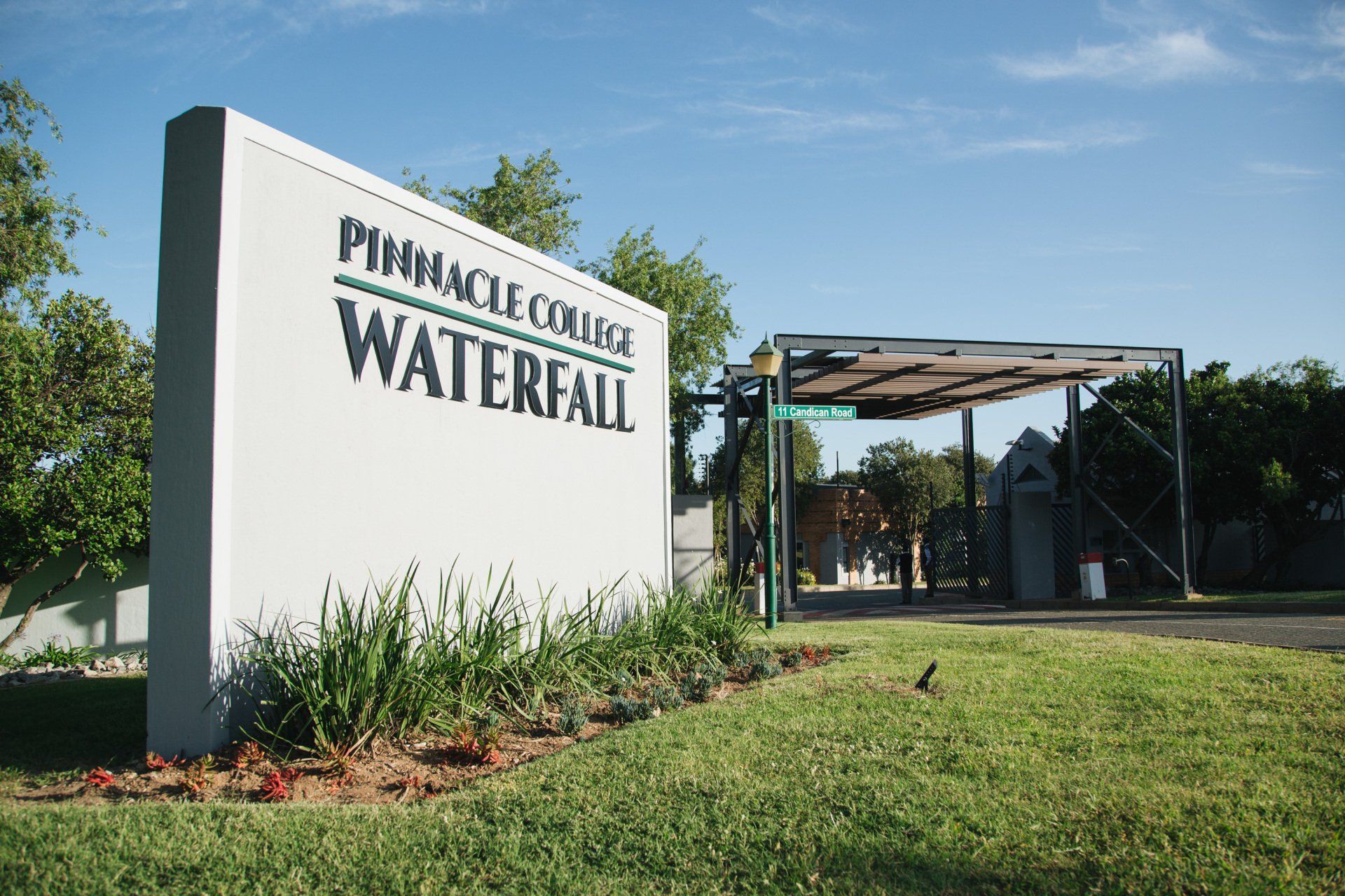 A large white sign that says pinnacle exchange waterfall