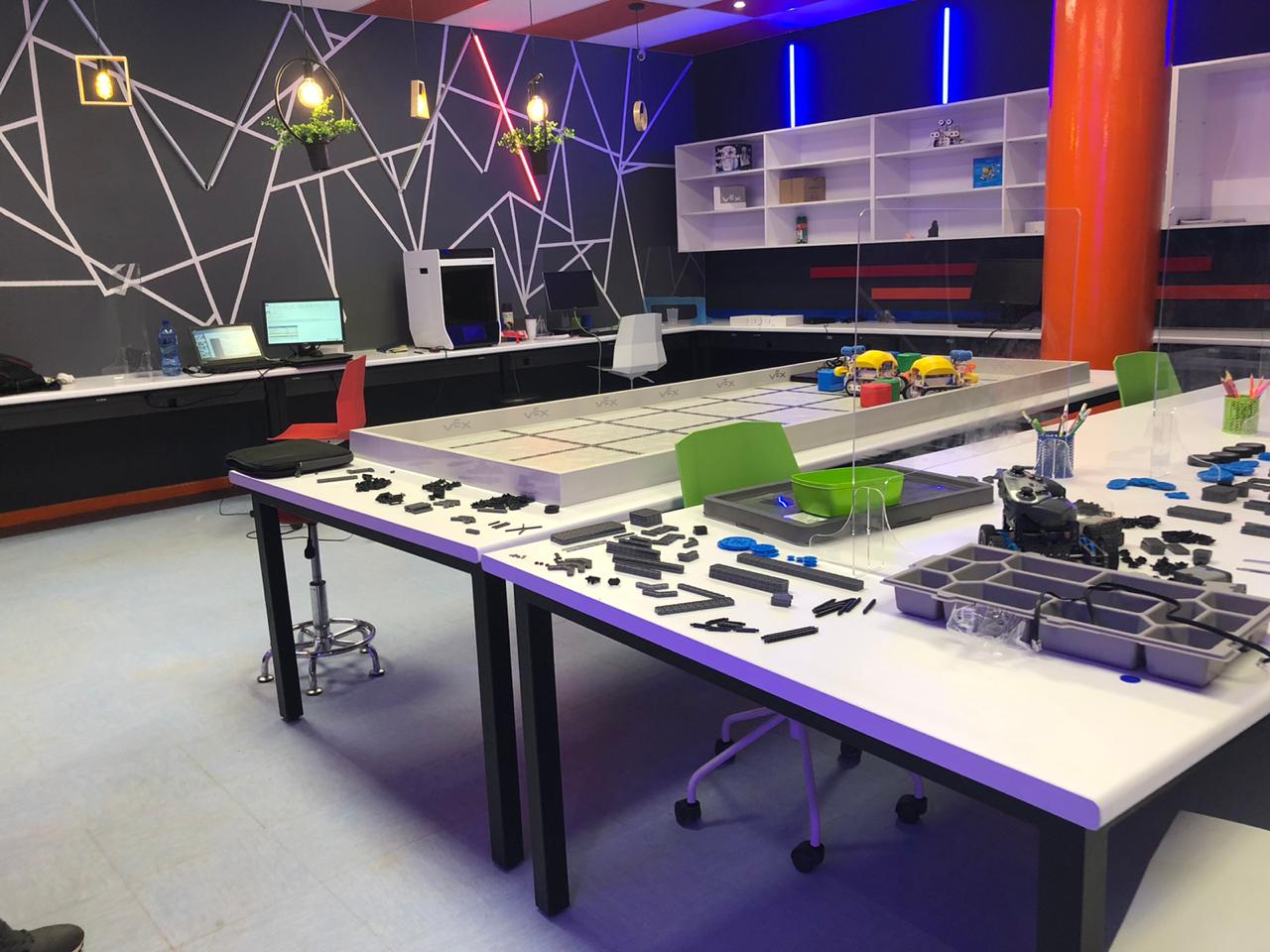 A room with a lot of tables and chairs