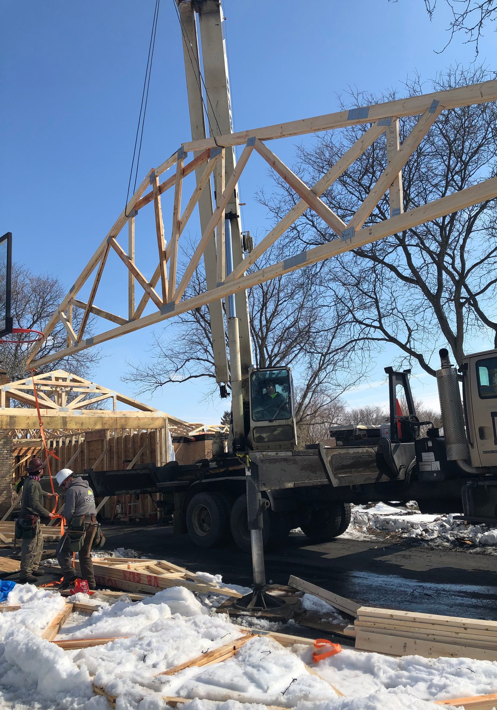 A man on a ladder in a building under construction