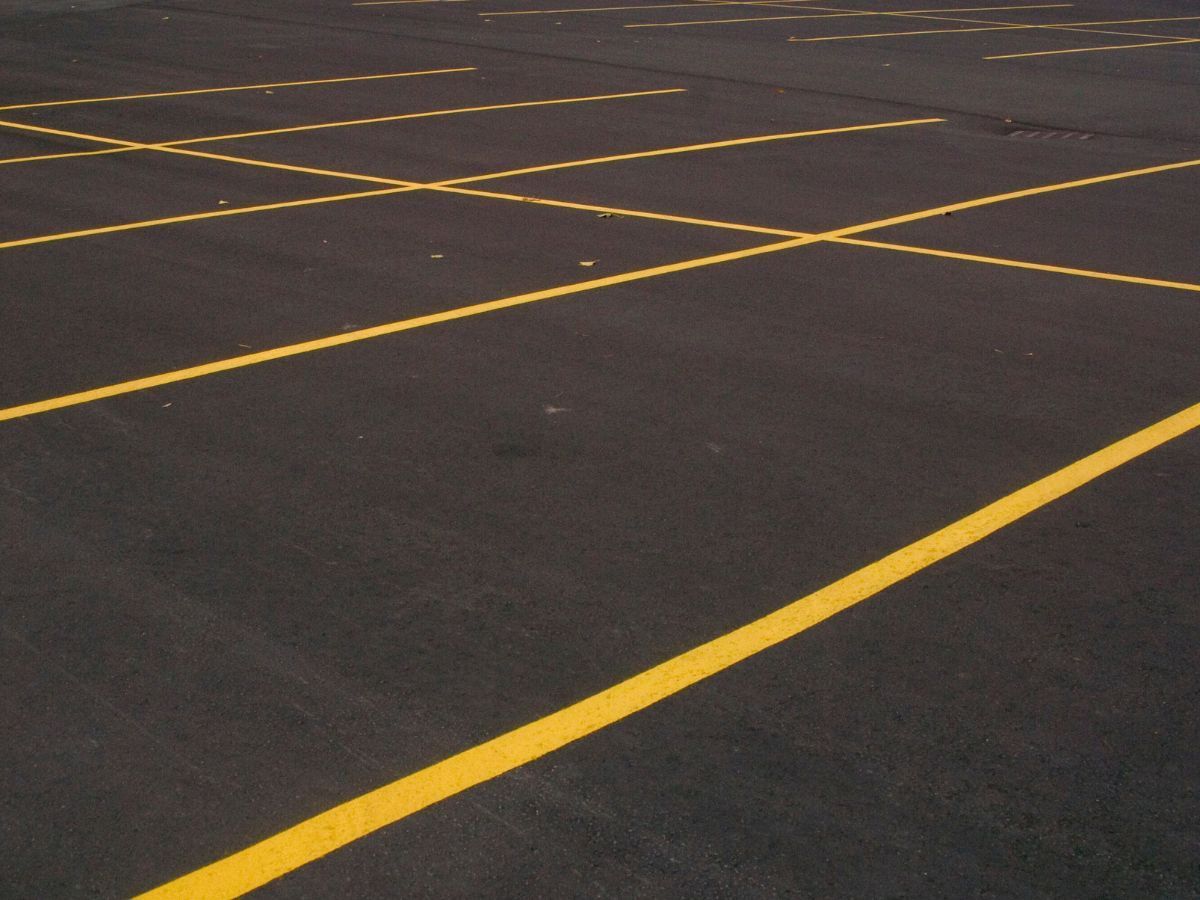A parking lot with yellow lines on it