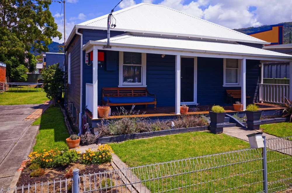 A Blue House with A White Roof and A Porch — Thomas Croker Constructions In Myrtleville, NSW