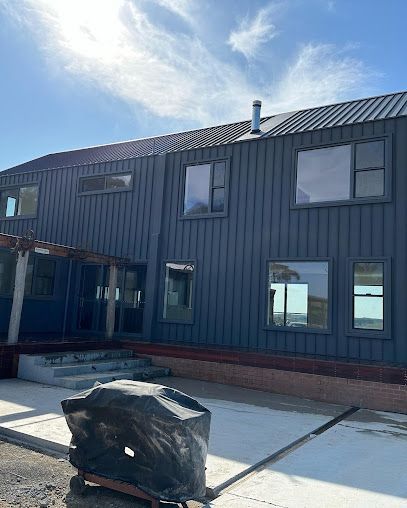 A large house with a lot of windows is being built. — Thomas Croker Constructions In Myrtleville, NSW