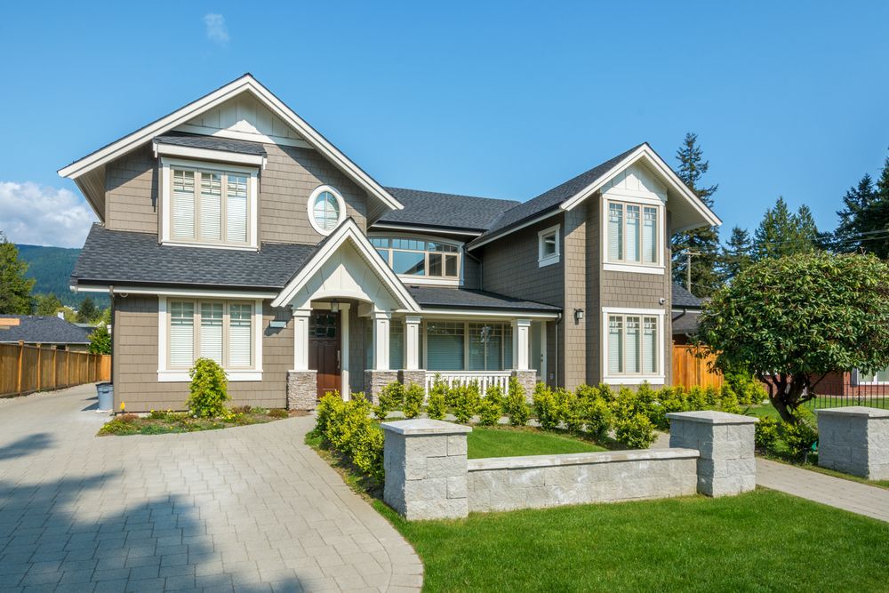 A Large House with A Lush Green Lawn in Front of It — Thomas Croker Constructions In Myrtleville, NSW