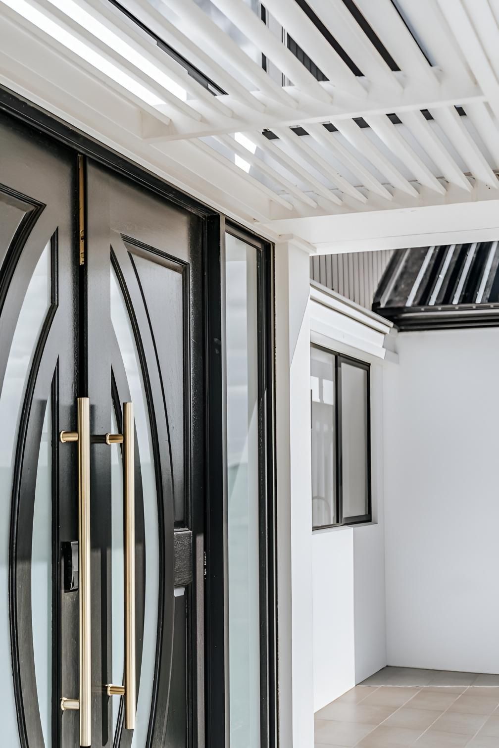 Black Front Door With Gold Handles — Thomas Croker Constructions In Bowral, NSW