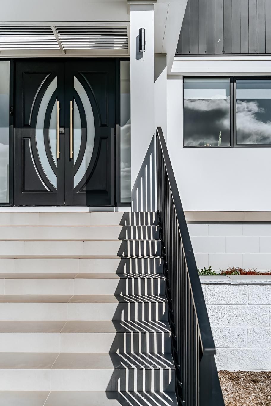 Modern Home Entrance With Steps, Black Door, and Metal Railing — Thomas Croker Constructions In Moss Vale, NSW