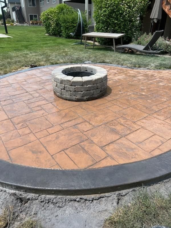 stamped concrete patio with firepit