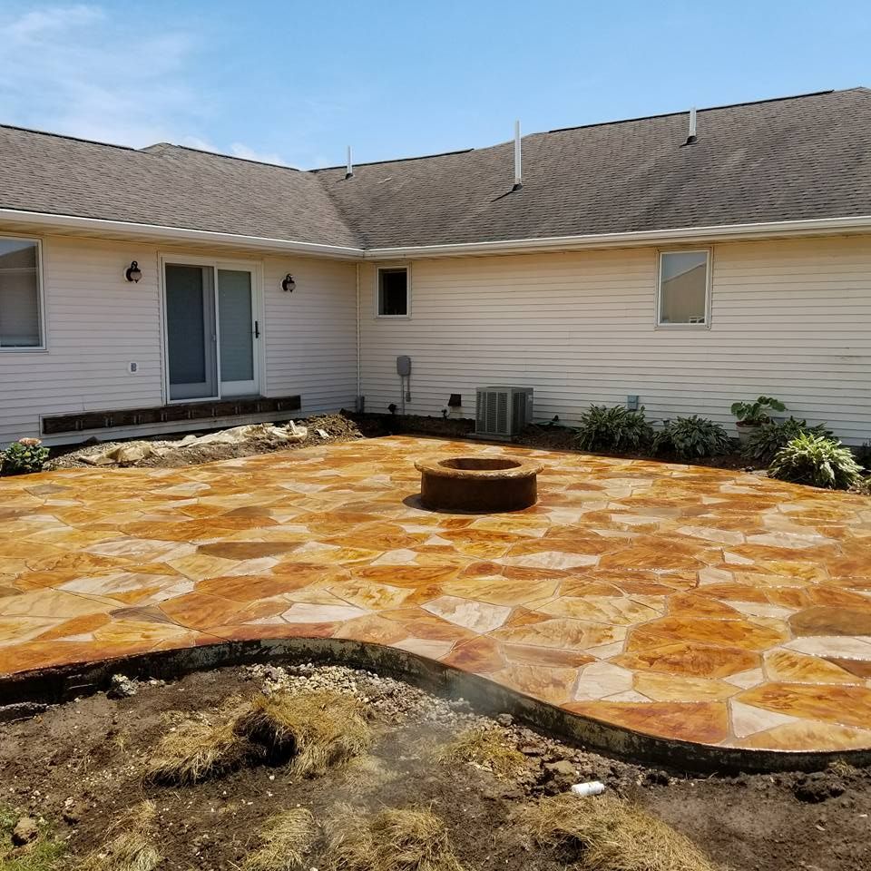 stamped concrete patio with firepit
