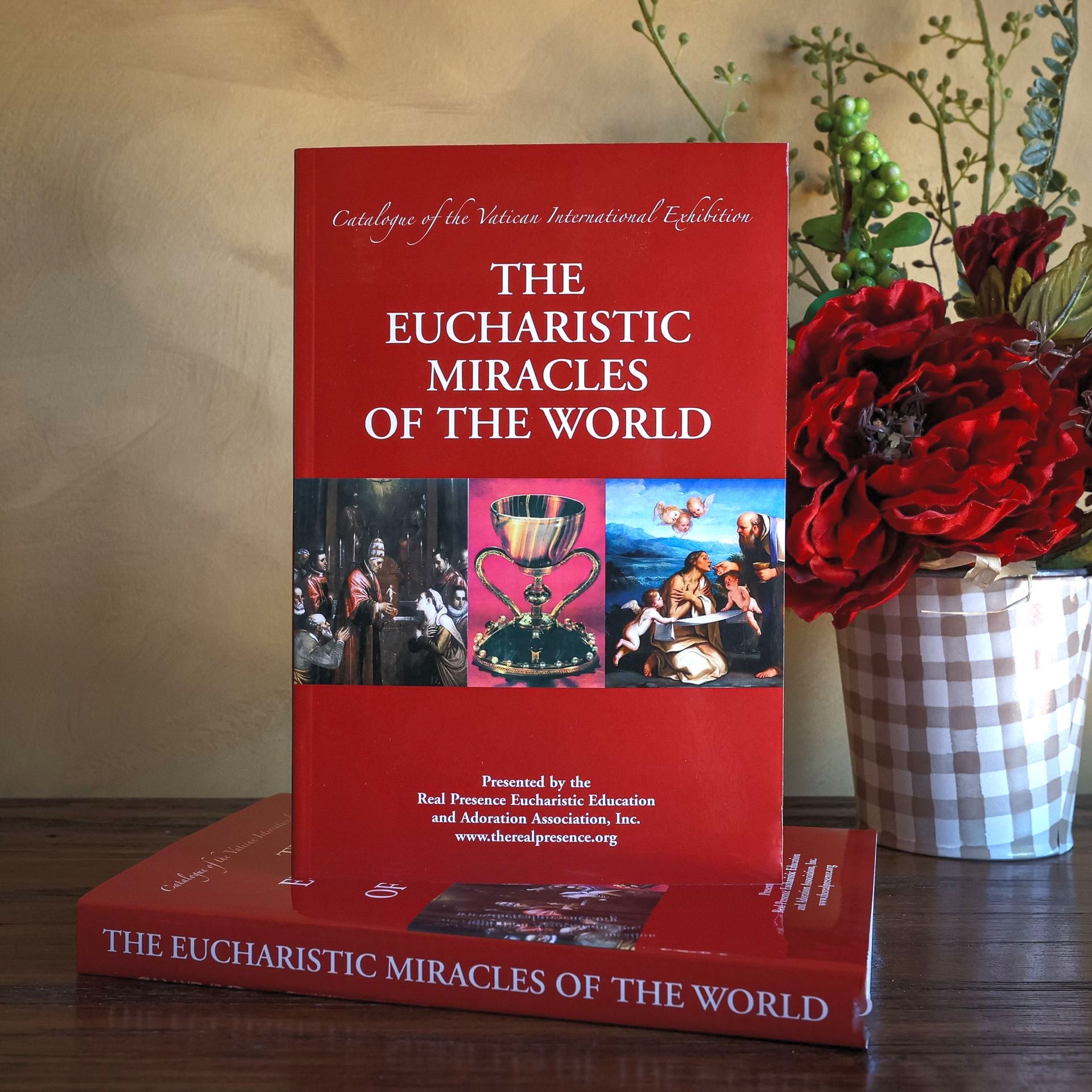 A red book titled The Eucharistic Miracles of the World