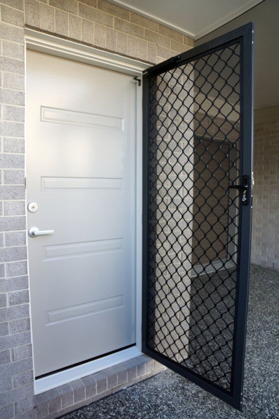 An installed security screen on a door in Townsville